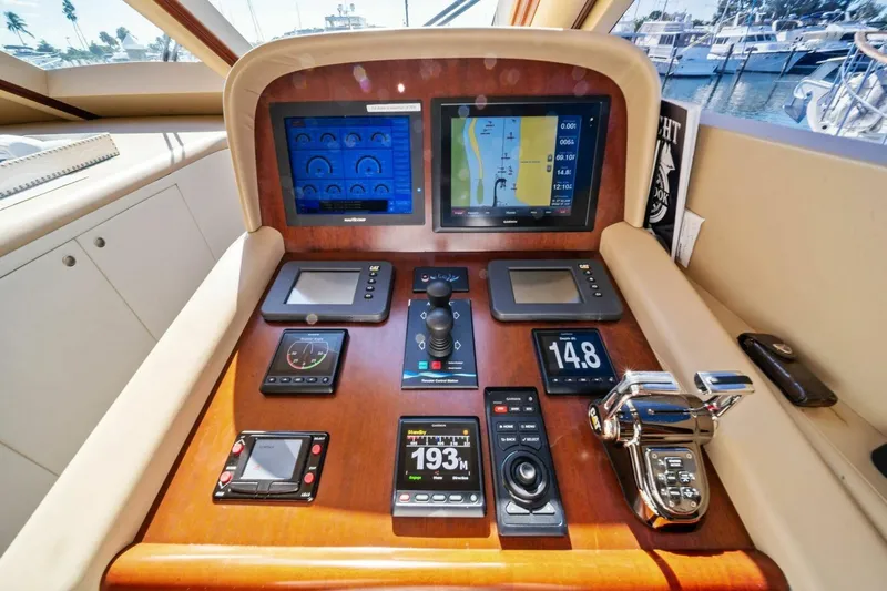 Summerwind Yacht Photos Pics Control panel of a 2005 Lazzara 80 yacht with navigation screens and controls.