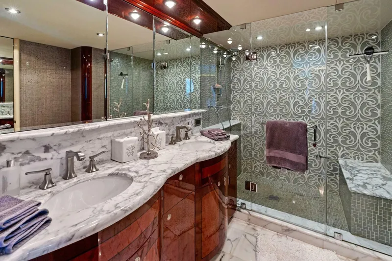 Summerwind Yacht Photos Pics Luxurious yacht bathroom with marble countertops and ornate glass shower, 2005 Lazarra 80 model.