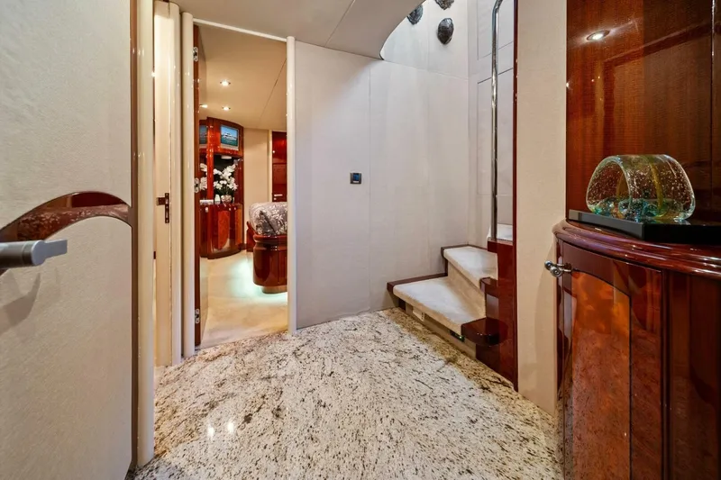 Summerwind Yacht Photos Pics Luxurious interior of 2005 Lazarra 80 yacht with elegant wood finishes and modern decor.