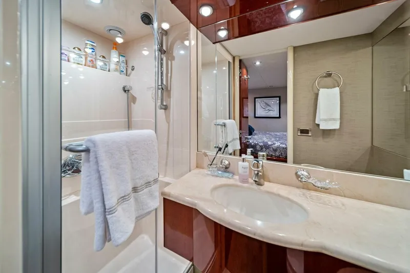 Summerwind Yacht Photos Pics Luxurious bathroom in 2005 Lazarra 80 yacht with elegant fixtures and modern amenities.