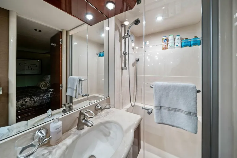 Summerwind Yacht Photos Pics Luxurious bathroom in 2005 Lazarra 80 yacht with modern fixtures and elegant design.