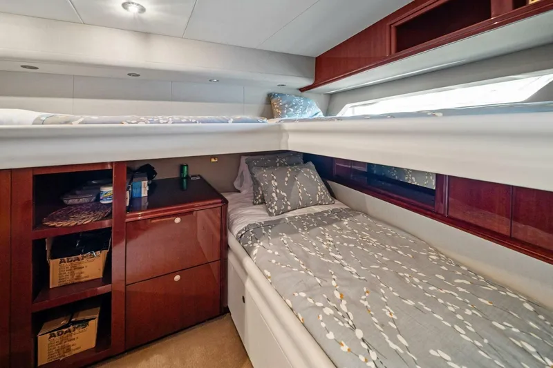 Summerwind Yacht Photos Pics Luxurious 2005 Lazarra 80 yacht cabin with bunk beds and elegant wood cabinetry.