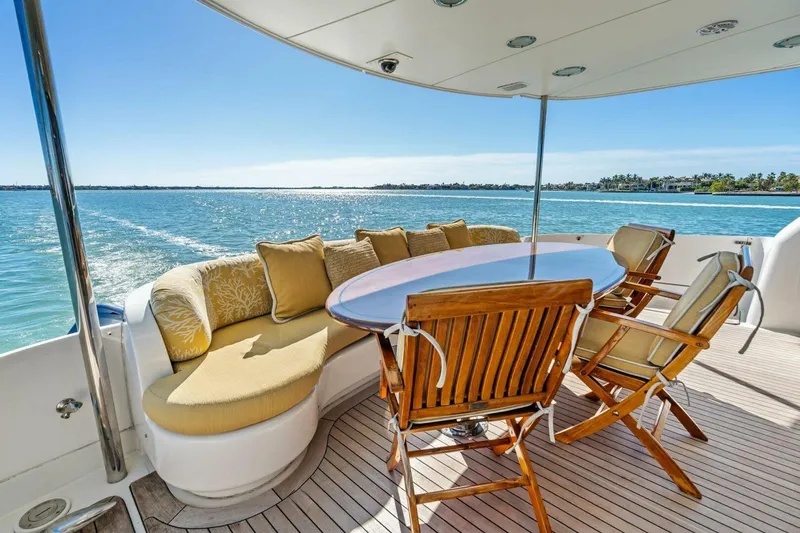 Summerwind Yacht Photos Pics Luxurious 2005 Lazzara 80 yacht deck with elegant seating and ocean view.