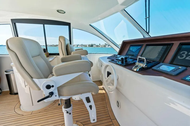 Summerwind Yacht Photos Pics Luxurious 2005 Lazarra 80 yacht helm with modern controls and plush seating.