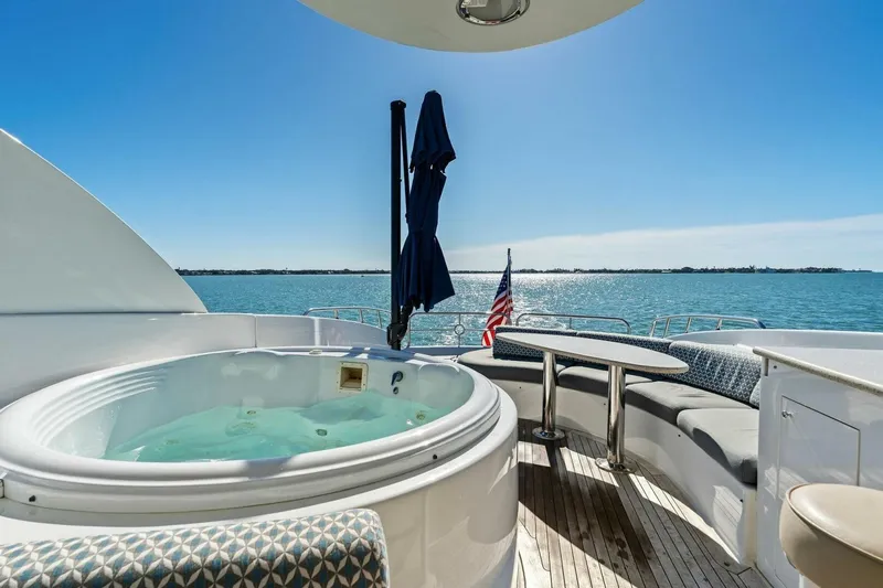 Summerwind Yacht Photos Pics Luxurious 2005 Lazarra 80 yacht deck with hot tub and ocean view.