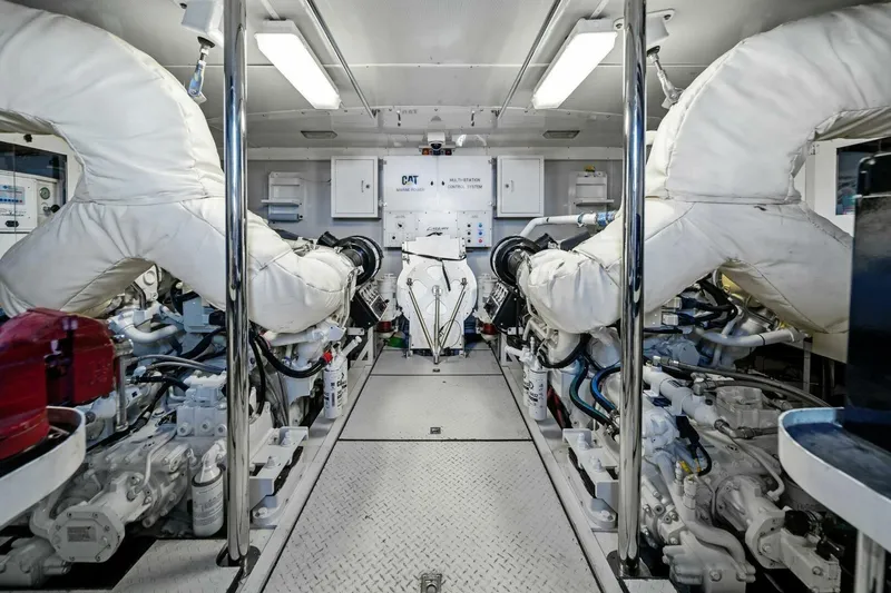 Summerwind Yacht Photos Pics Engine room of a 2005 Lazarra 80 yacht, featuring advanced machinery and equipment.