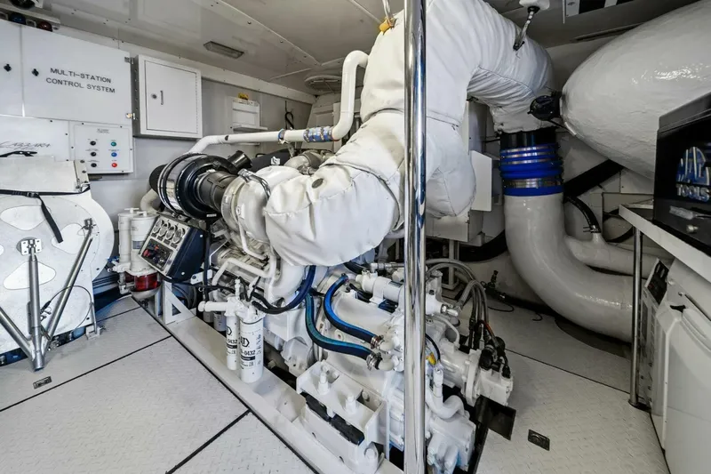 Summerwind Yacht Photos Pics Engine room of a 2005 Lazarra 80 yacht, featuring advanced control systems and machinery.