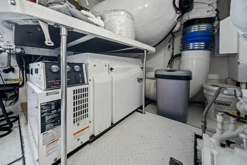 Summerwind Yacht Photos Pics Engine room of 2005 Lazarra 80 yacht with Onan generator and mechanical equipment.
