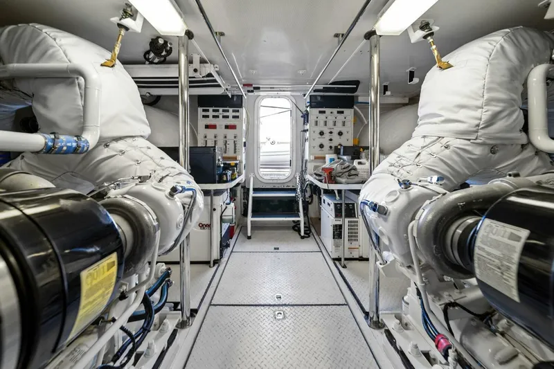 Summerwind Yacht Photos Pics Engine room of 2005 Lazarra 80 yacht, featuring advanced machinery and control panels.
