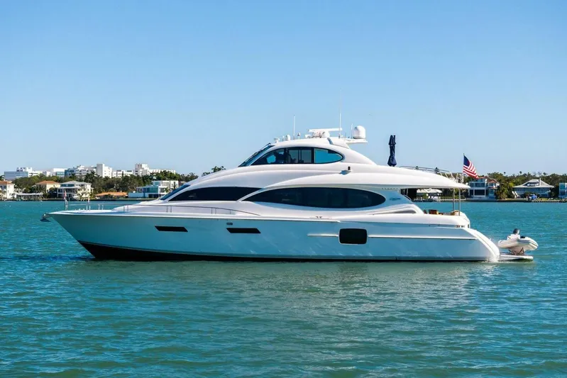 Summerwind Yacht Photos Pics Luxury 2005 Lazarra 80 yacht cruising on calm waters, clear blue sky backdrop.