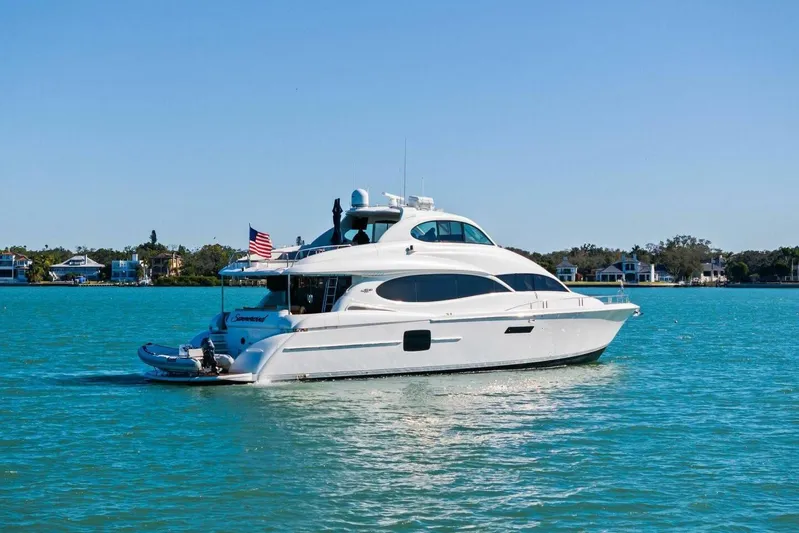 Summerwind Yacht Photos Pics Luxury 2005 Lazarra 80 yacht cruising on clear blue waters.