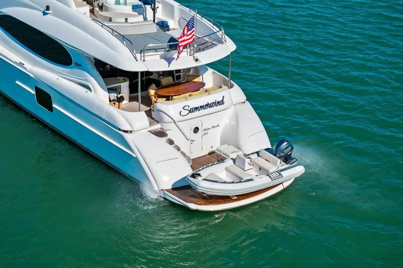 Summerwind Yacht Photos Pics Luxurious 2005 Lazarra 80 yacht cruising on clear blue waters.