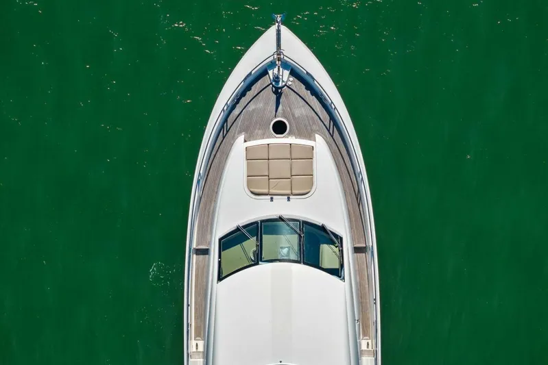 Summerwind Yacht Photos Pics Aerial view of 2005 Lazarra 80 yacht on green water.