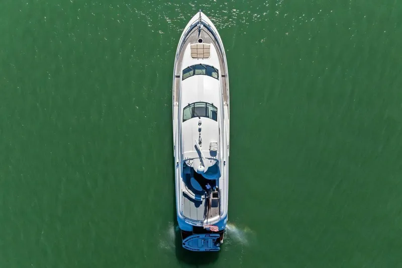 Summerwind Yacht Photos Pics Aerial view of 2005 Lazarra 80 yacht cruising on green water.