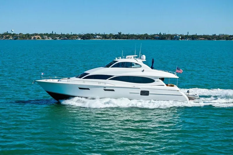 Summerwind Yacht Photos Pics Luxury 2005 Lazarra 80 yacht cruising on turquoise waters under clear blue sky.