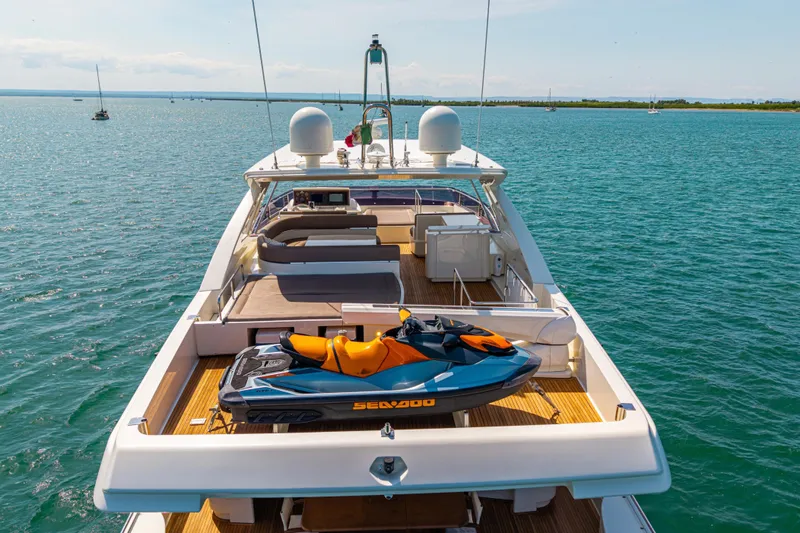 Papaito Yacht Photos Pics Luxurious 2013 Ferretti Yachts 800 with jet ski on deck, cruising in serene waters.