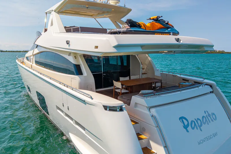 Papaito Yacht Photos Pics Luxurious 2013 Ferretti Yachts 800 on serene waters, featuring a jet ski on deck.