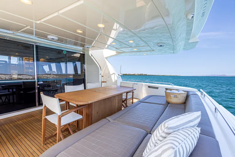 Papaito Yacht Photos Pics Luxurious 2013 Ferretti Yachts 800 deck with seating, table, and ocean view.