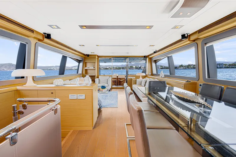 Papaito Yacht Photos Pics Luxurious interior of 2013 Ferretti Yachts 800 with elegant dining area and panoramic windows.