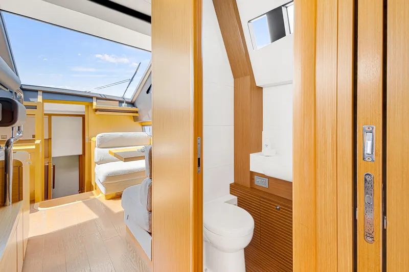 Papaito Yacht Photos Pics Luxurious interior of 2013 Ferretti Yachts 800, featuring modern bathroom and seating area.