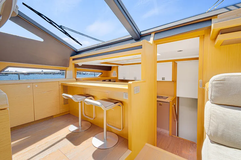 Papaito Yacht Photos Pics Luxurious interior of 2013 Ferretti Yachts 800 with modern bar and seating.