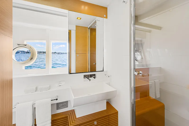 Papaito Yacht Photos Pics Luxurious bathroom on 2013 Ferretti Yachts 800 with ocean view and modern fixtures.