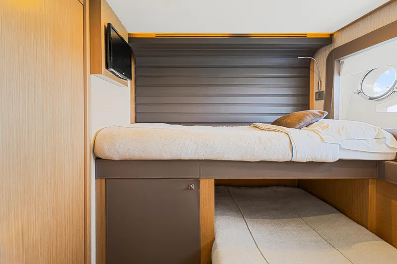 Papaito Yacht Photos Pics Luxurious cabin interior of 2013 Ferretti Yachts 800 with cozy bedding and porthole view.