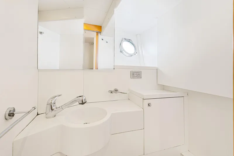 Papaito Yacht Photos Pics Luxurious bathroom in 2013 Ferretti Yachts 800, featuring sleek white design and modern fixtures.