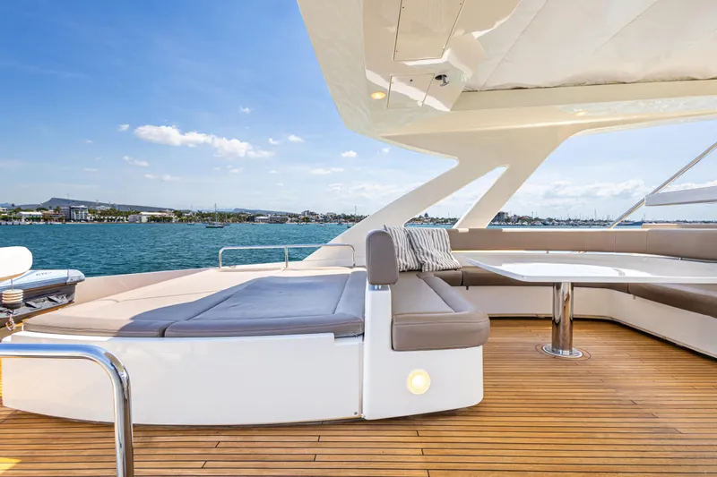 Papaito Yacht Photos Pics Luxurious 2013 Ferretti Yachts 800 deck with seating, overlooking serene waters.
