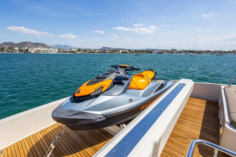 Papaito Yacht Photos Pics Jet ski on Ferretti Yachts 800, 2013 model, docked with scenic ocean view.