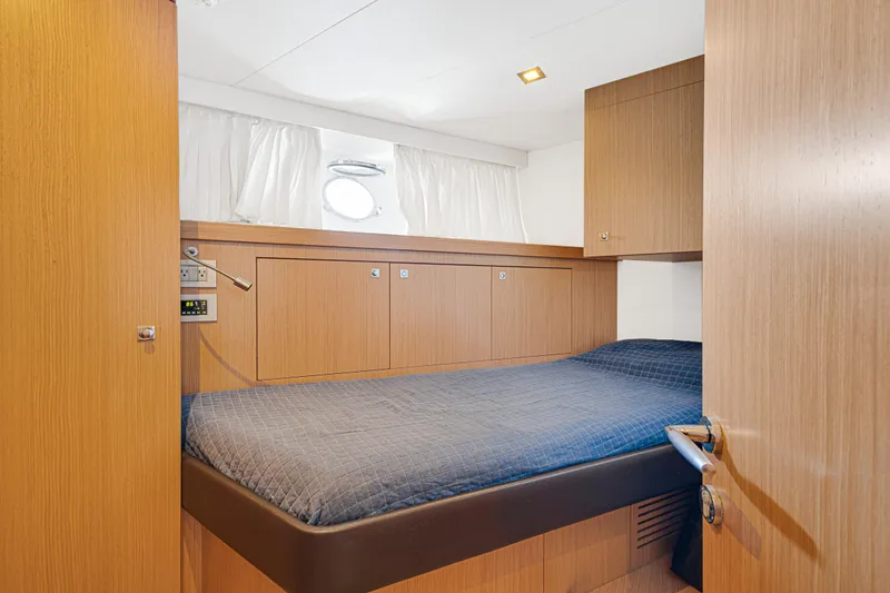 Papaito Yacht Photos Pics Luxurious cabin interior of 2013 Ferretti Yachts 800 with wooden finish and cozy bed.