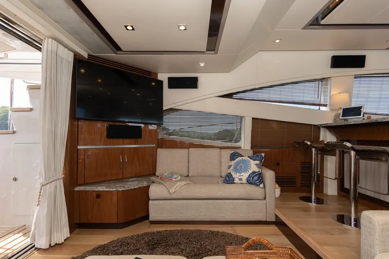 Janie Yacht Photos Pics Luxurious interior of 2018 Sea Ray L650 Fly yacht with modern decor and entertainment system.