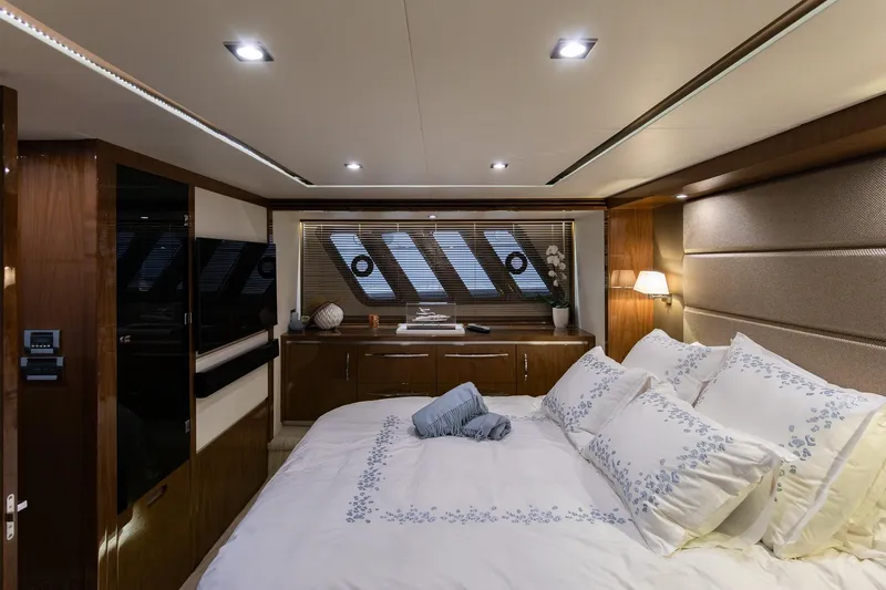 Janie Yacht Photos Pics Luxurious 2018 Sea Ray L650 Fly yacht bedroom with elegant decor and ambient lighting.