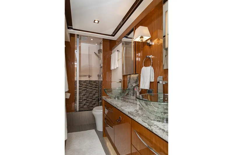 Janie Yacht Photos Pics Luxurious bathroom in 2018 Sea Ray L650 Fly yacht with glass sinks and modern shower.