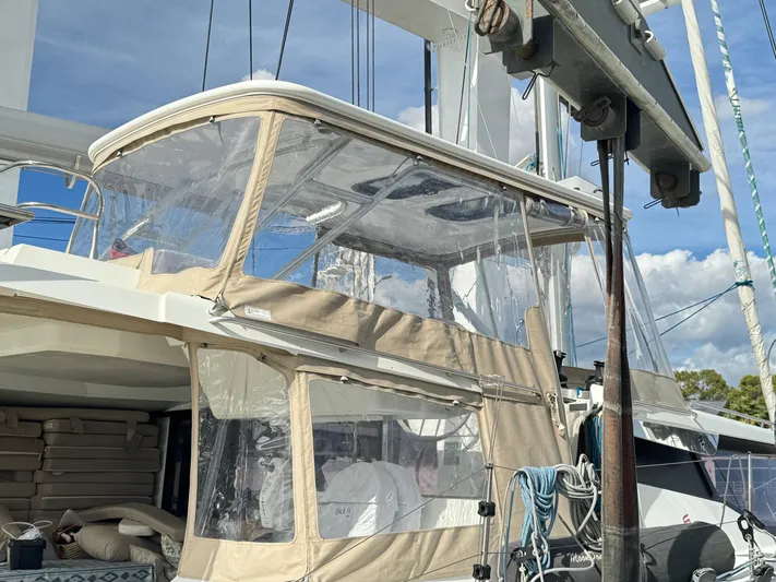 Moon Doggie Yacht Photos Pics 2022 Fountaine Pajot Tanna 47 yacht with clear canopy and beige trim.