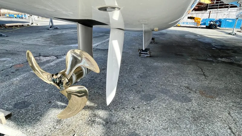 Moon Doggie Yacht Photos Pics Propeller and rudder of 2022 Fountaine Pajot Tanna 47 catamaran on dry dock.