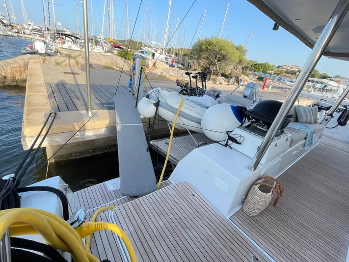 Moon Doggie Yacht Photos Pics 2022 Fountaine Pajot Tanna 47 yacht docked at marina with inflatable boat.