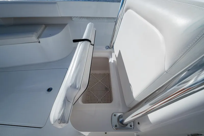 Checkered Flag Yacht Photos Pics 2011 Bahama 37 boat interior with white seating and storage compartment.