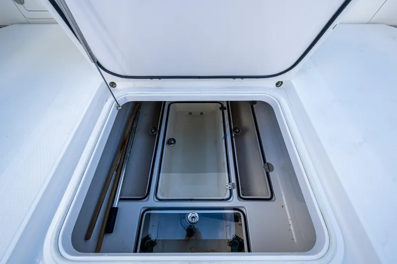 Checkered Flag Yacht Photos Pics Open storage compartment on a 2011 Bahama 37 boat, showcasing interior space.