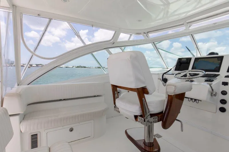 Tin Bender Yacht Photos Pics 2009 Albemarle 360 XF yacht helm with white seating and navigation equipment.