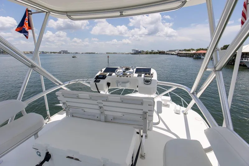 Tin Bender Yacht Photos Pics 2009 Albemarle 360 XF boat helm with ocean view, featuring navigation equipment and seating.