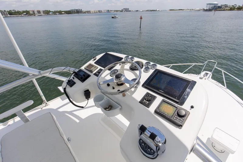 Tin Bender Yacht Photos Pics Helm of 2009 Albemarle 360 XF boat with navigation equipment, steering wheel, and ocean view.