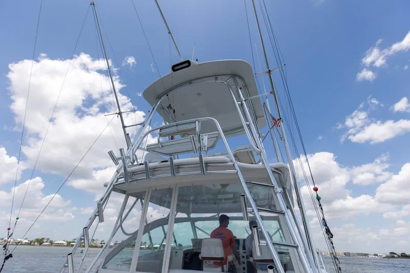 Tin Bender Yacht Photos Pics 2009 Albemarle 360 XF boat on water, clear sky, fishing rods visible.