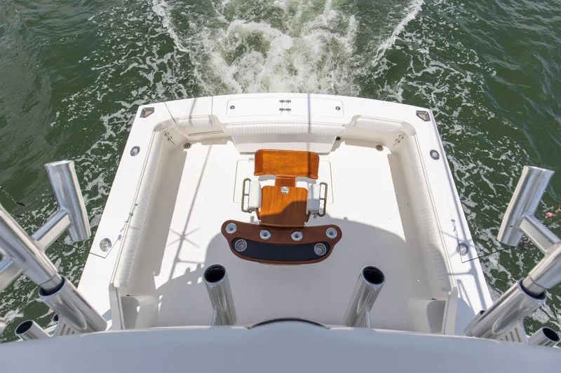 Tin Bender Yacht Photos Pics 2009 Albemarle 360 XF boat deck with fishing chair, surrounded by ocean waves.