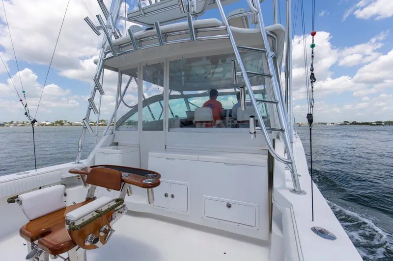 Tin Bender Yacht Photos Pics 2009 Albemarle 360 XF boat on water, featuring fishing chair and helm station.