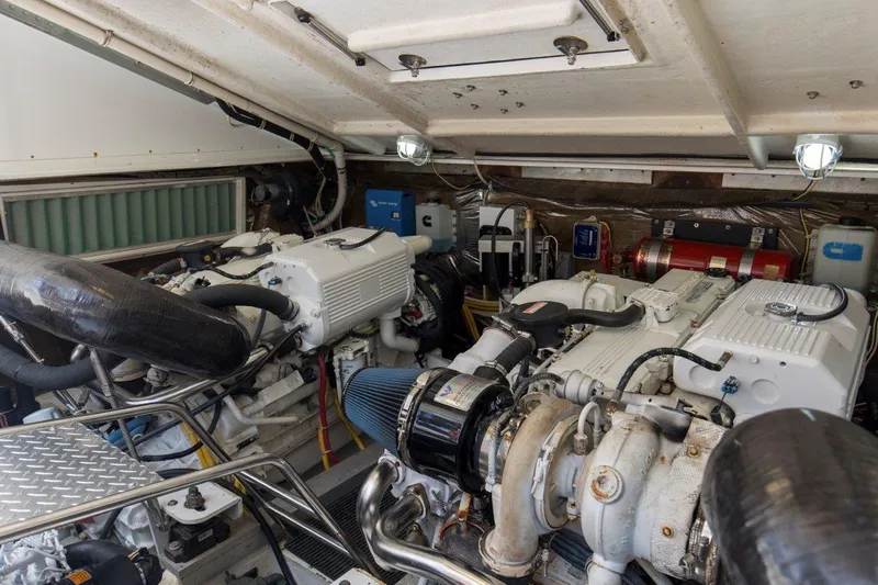 Tin Bender Yacht Photos Pics Engine room of 2009 Albemarle 360 XF boat, featuring dual engines and mechanical components.