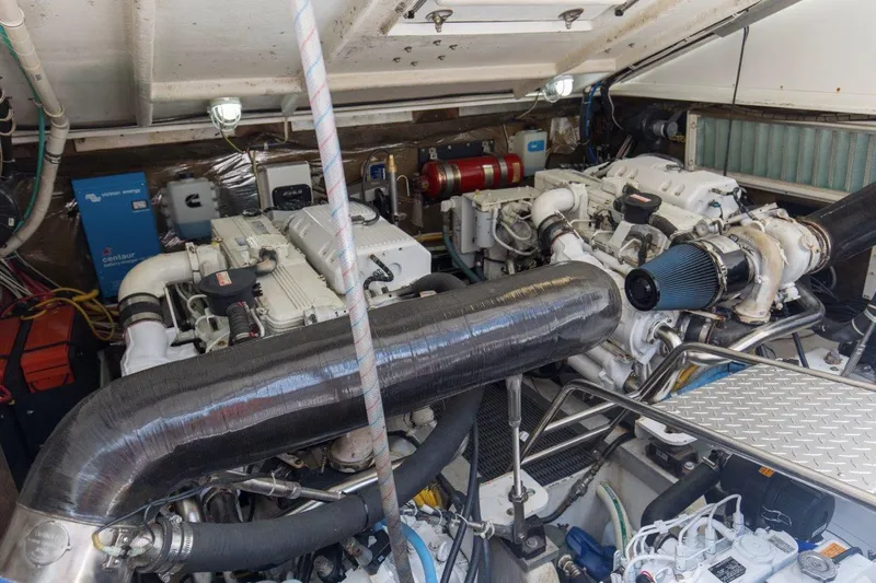Tin Bender Yacht Photos Pics Engine room of 2009 Albemarle 360 XF boat, featuring dual engines and mechanical components.