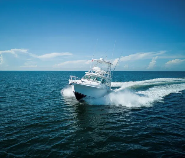 Tin Bender Yacht Photos Pics 2009 Albemarle 360 XF boat cruising on open sea under clear blue sky.