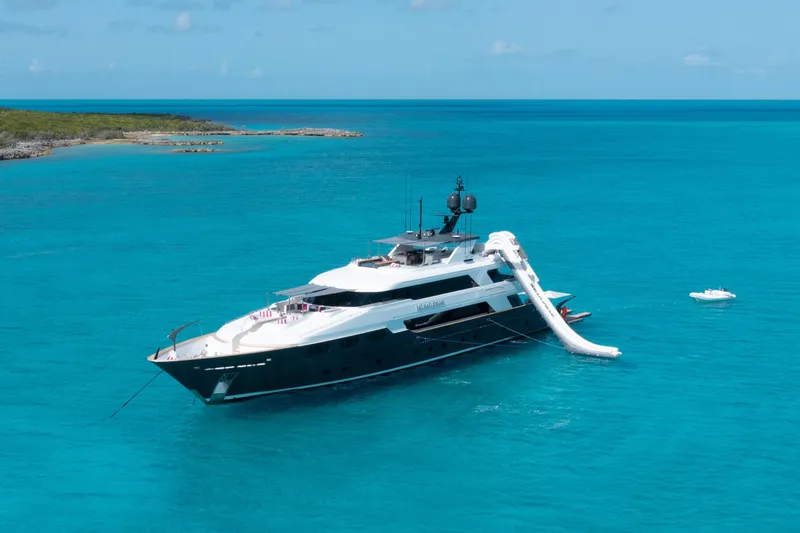No Bad Ideas Yacht Photos Pics Luxurious 2000 Trinity Yachts Trinity 160 anchored in clear turquoise waters.