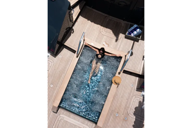 No Bad Ideas Yacht Photos Pics Person relaxing in a pool on a 2000 Trinity Yachts Trinity 160.